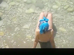 Nude woman in the beach