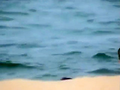 Skinny girl rushing out of the water