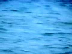 Skinny girl rushing out of the water