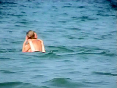 Skinny girl rushing out of the water