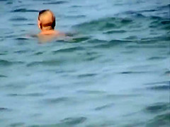 Skinny girl rushing out of the water
