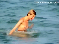 Skinny girl rushing out of the water