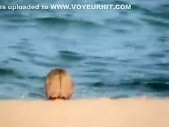 Skinny girl rushing out of the water