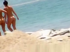Two girls naked at beach