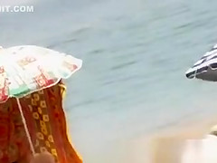 Two girls naked at beach