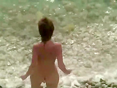 Petite milf rides a dick on the beach