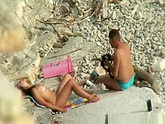 Nude brunette woman posing for the camera