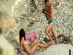 Nude brunette woman posing for the camera