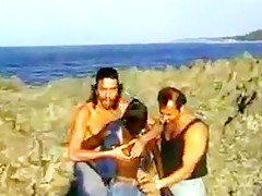 African hairy girl and 2 guys on the rocks