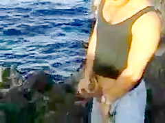 African hairy girl and 2 guys on the rocks