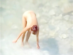 Mature couple beach play