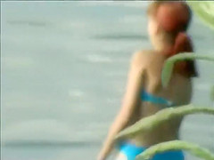 Teen girl spied as she swims in a lake