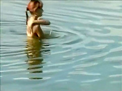 Teen girl spied as she swims in a lake