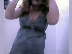 Woman showering and dressing in beach cabin