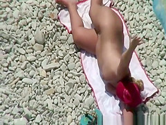 Chubby mature nudist woman with red cap