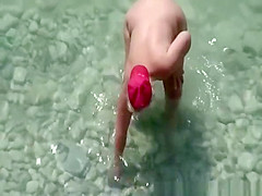 Chubby mature nudist woman with red cap