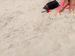 Fit blonde exercises on beach
