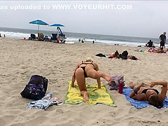 Fit blonde exercises on beach