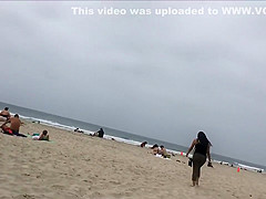 Fit blonde exercises on beach