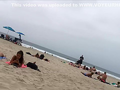 Fit blonde exercises on beach