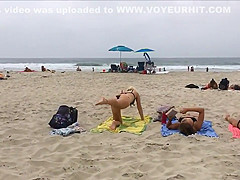 Fit blonde exercises on beach