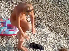 Big topless natural breasts on beach