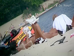 Nude woman with pony tail sunbathing