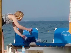 Girl on the beach dresses pants.