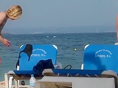 Girl on the beach dresses pants.