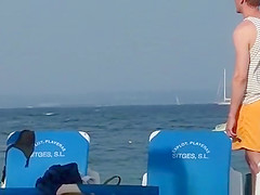 Girl on the beach dresses pants.