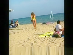 Sexy blonde chick in yellow bikini