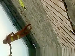 Sexy blonde chick in yellow bikini