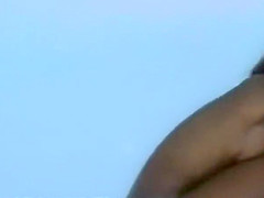 Woman removes her bikini on a beach