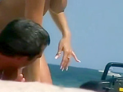 Woman removes her bikini on a beach