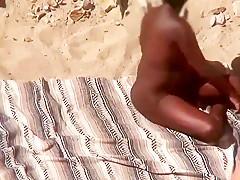 Interracial mature beach couple