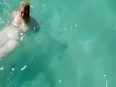 Chubby nudist woman in the beach