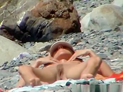 Skinny nudist woman sunbathing