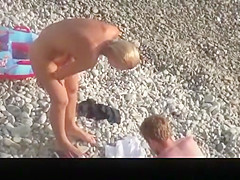 Hot blonde nudist woman swimming