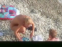 Hot blonde nudist woman swimming