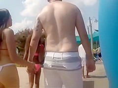 Brunette girl with long hair and nice ass in bikini