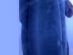 Busty chick caught in beach cabin