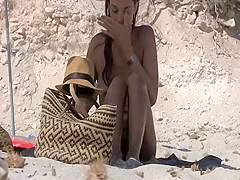 Seductive naked babe spied on a beach