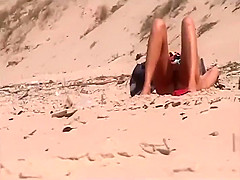 Horny girl spied by a voyeur on a beach