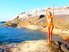 Nude beach hot blond posing on the rocks