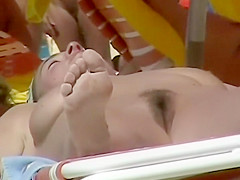 Voyeur films some sexy nudist women