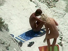 Nude couple secretly filmed in the rocky beach