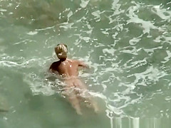 Nude couple secretly filmed in the rocky beach