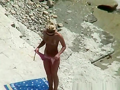 Nude couple secretly filmed in the rocky beach