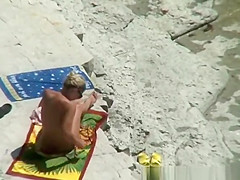 Nude couple secretly filmed in the rocky beach