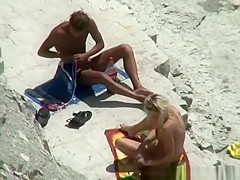 Nude couple secretly filmed in the rocky beach